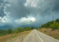 Mountain asphalt road rises and turns right Royalty Free Stock Photo