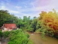 Mountain atmosphere in the countryside with old house, river, trees with bright blue sky Royalty Free Stock Photo