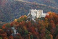 Mountain autumn landscape with colorful forest and Uhrovec castle, Slovakia