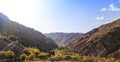 Mountain autumn landscape. Gorge at sunset. Yellow trees. Kyrgyzstan, Ak-Tuz gorge Royalty Free Stock Photo