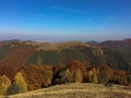 Mountain autumn landscape with rusty trees in Cindrel Mountains, Romania