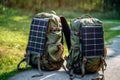 Mountain backpack with solar charger for travel, outdoor adventures and hiking. Solar energy in modern gadgets powered by