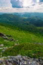 Mountain behind the valley viewed from rocky cliff