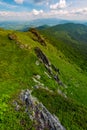 Mountain behind the valley viewed from rocky cliff