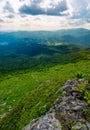 Mountain behind the valley viewed from rocky cliff