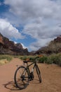Mountain bicycle is placed in the middle of a dirt path in the wilderness Royalty Free Stock Photo