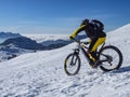 Mountain bike in the alps in the snow