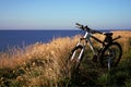 Mountain bike on a cliff near the sea Royalty Free Stock Photo