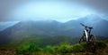 Mountain Bike on the Mountain Cloudy Background. Mountain Bicycle Concept wallpaper Royalty Free Stock Photo