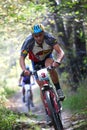 Mountain bike competition in forest Royalty Free Stock Photo