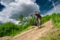 Mountain bike cyclist doing wheelie stunt on a mtb bike