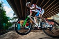 Mountain bike cyclist doing wheelie stunt on a mtb bike