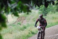 Mountain bike cyclist man dirty mud forest race