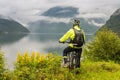 Mountain bike cyclist near fjord, Norway Royalty Free Stock Photo