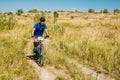 Mountain Bike cyclist riding track in meadow at Royalty Free Stock Photo