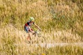 Mountain Bike cyclist riding track in meadow with Royalty Free Stock Photo