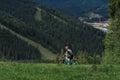 Mountain bike cyclist in sport equipment and helmet riding on rugged trails Royalty Free Stock Photo