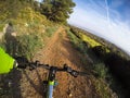 Mountain bike going downhill on a dirt path Royalty Free Stock Photo