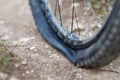 Mountain bike got Flat bike tire on trail. Royalty Free Stock Photo