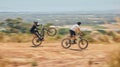 Mountain bike, men and race with speed, dirt and nature in summer with wheelie, extreme sport and motion blur. Friends