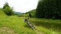 Mountain bike near a small river in mountains Royalty Free Stock Photo