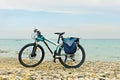 Mountain bike parked on the beach.