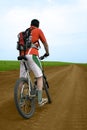 Mountain bike race on ground road Royalty Free Stock Photo