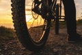 Mountain bike rear wheel detail. Back shot of mountain bike on sunset.