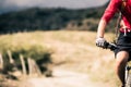 Mountain bike rider on country road, track trail in inspirational landscape Royalty Free Stock Photo