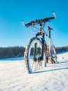 Mountain bike in snow. Lost path in deep snowdrift