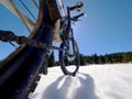 Front wheel of mountain bike blocked in snow. Snow riding. Royalty Free Stock Photo