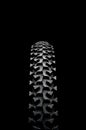 A mountain bike tire on black