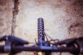 Mountain bike tyres outside, blurry handlebar, summer day, city mobility Royalty Free Stock Photo