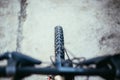 Mountain bike tyres outside, blurry handlebar, summer day, city mobility Royalty Free Stock Photo