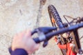 Mountain bike tyres outside, blurry handlebar, summer day, city mobility Royalty Free Stock Photo