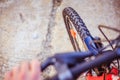 Mountain bike tyres outside, blurry handlebar, summer day, city mobility Royalty Free Stock Photo