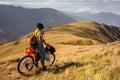 Mountain biker is checking gps location after Atsunta pass in th Royalty Free Stock Photo