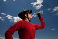 Mountain biker drinking from water bottle