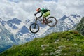 Mountain biker jumped, soaring mid-air against backdrop Royalty Free Stock Photo