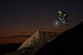 Mountain Biker jumping at dusk