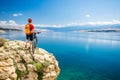 Mountain biker looking at view and riding on bike