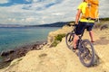 Mountain biker looking at view and riding a bike Royalty Free Stock Photo