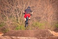 Mountain biker mid-air on downhill trail. Royalty Free Stock Photo