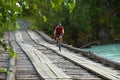 Mountain biker on old wooden bridge Royalty Free Stock Photo