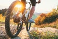 Mountain biker ride down from hill. Close up wheel image. Active