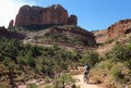 A Mountain Biker Rides Toward Sedona`s Famous Cathedral Rock