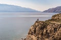 Mountain biker riding bike on rocks at the ocean Royalty Free Stock Photo