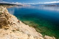 Mountain biker riding a bike on rocky trail path at sea Royalty Free Stock Photo