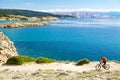 Mountain biker riding on bike at seaside path Royalty Free Stock Photo