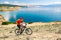 Mountain biker riding on bike in summer sunset woods Royalty Free Stock Photo